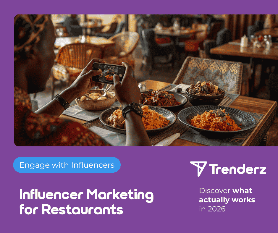 African restaurant owner reviews influencer marketing strategy on tablet at modern Abidjan restaurant