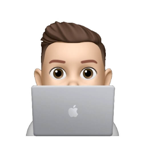 A man with an apple laptop in front of his face.