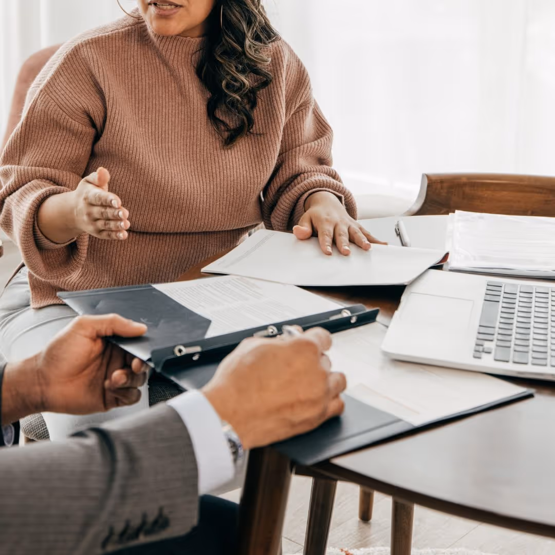 Two people reviewing documents