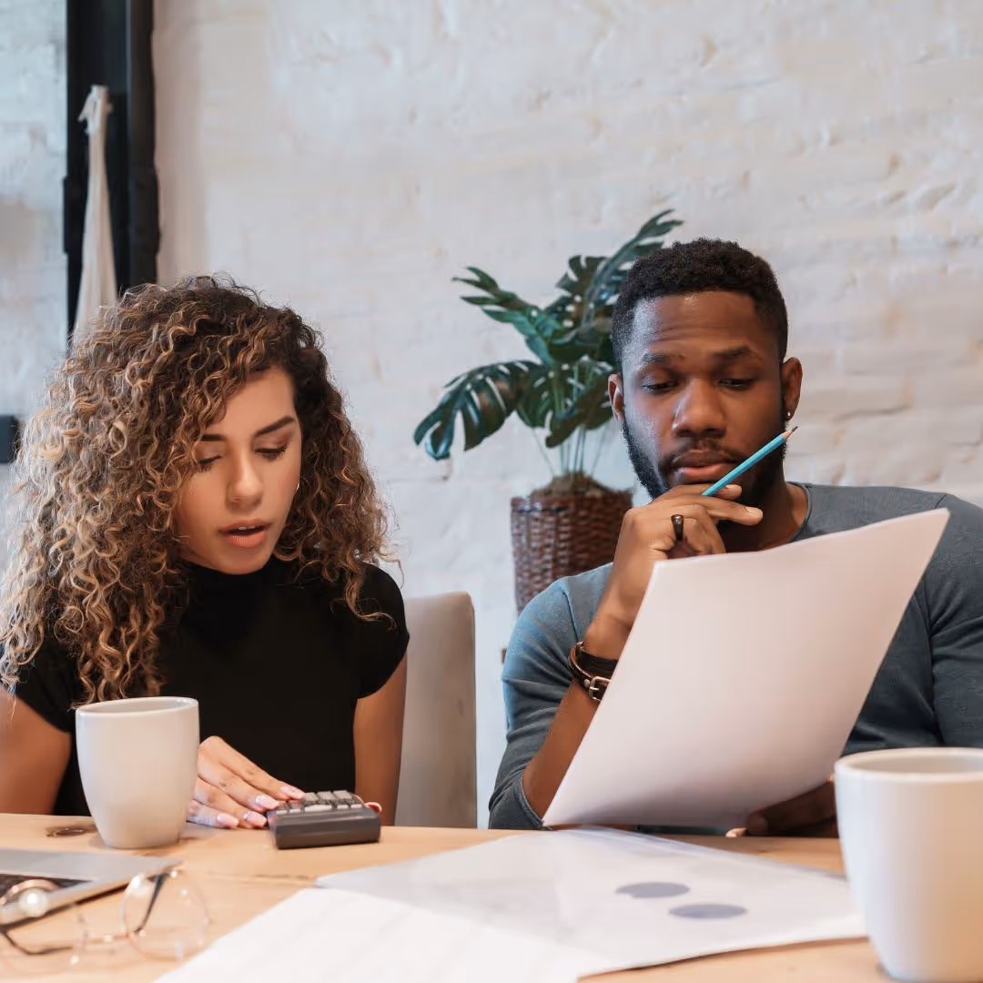 Two people reviewing documents