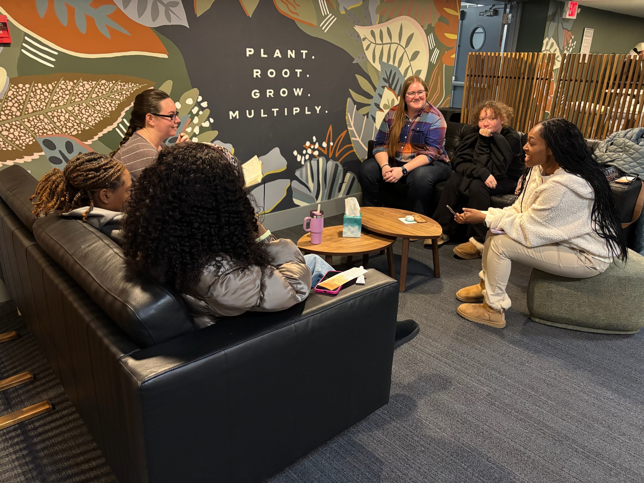 High school girls small group meeting in the grove.
