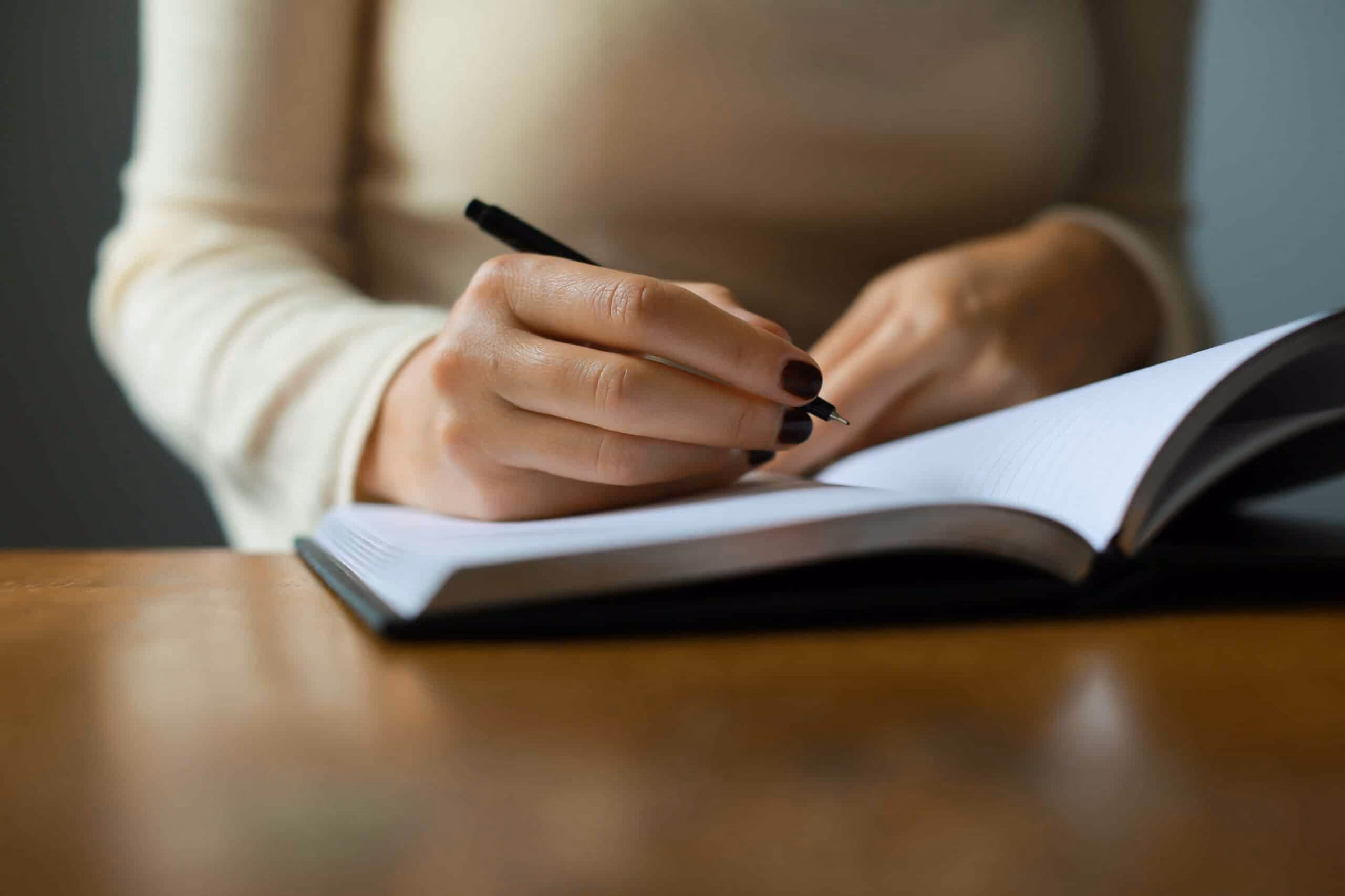 Woman writing in a notebook
