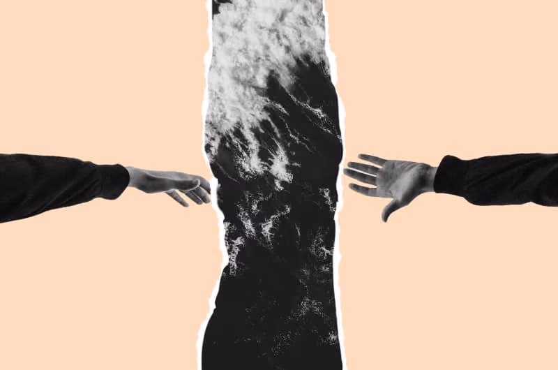 Two hands on a beige backdrop reaching out towards the ocean