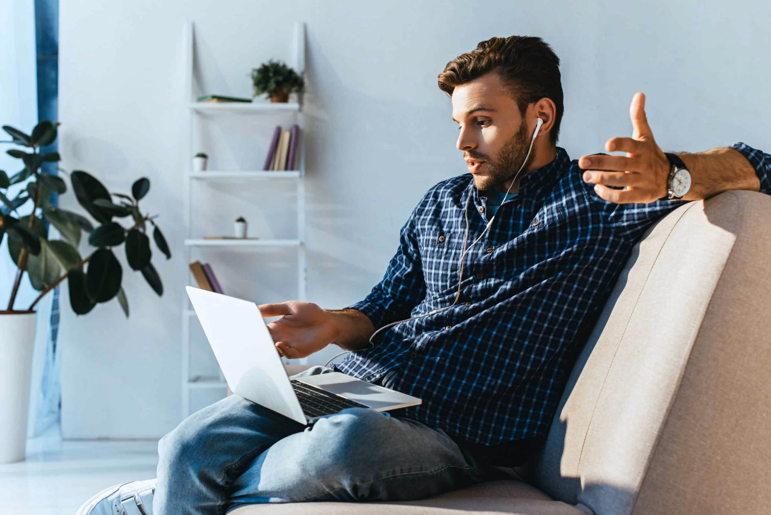 A man in a blue shirt during a telehealth call