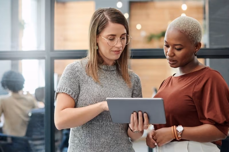 Employees with ADHD looking at a smart tablet