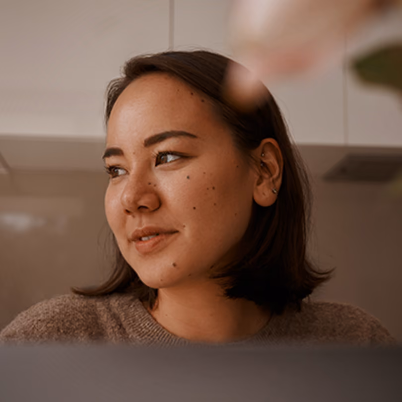Woman stares happily to her right