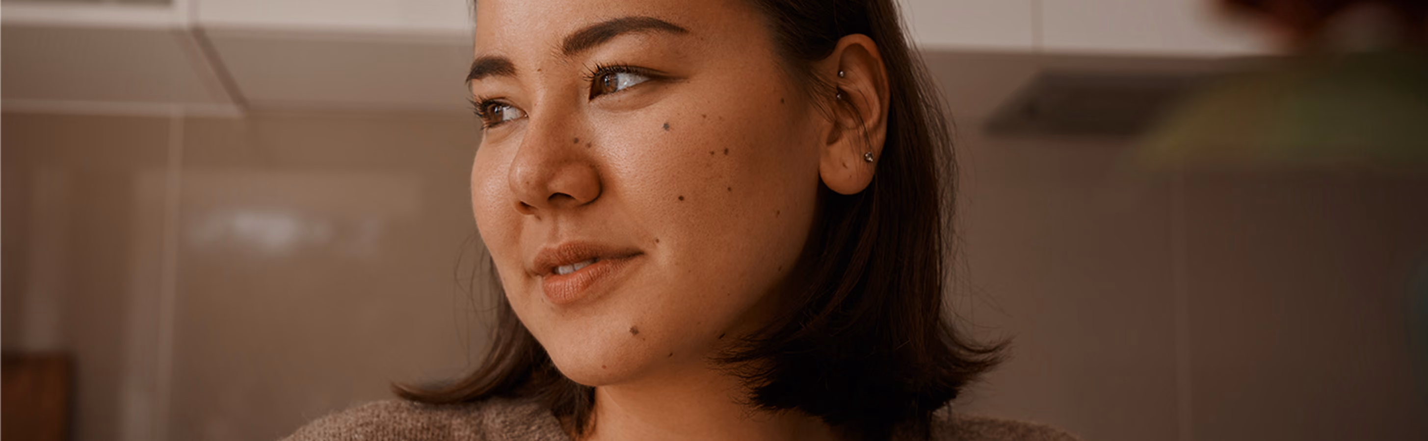 Woman stares happily to her right