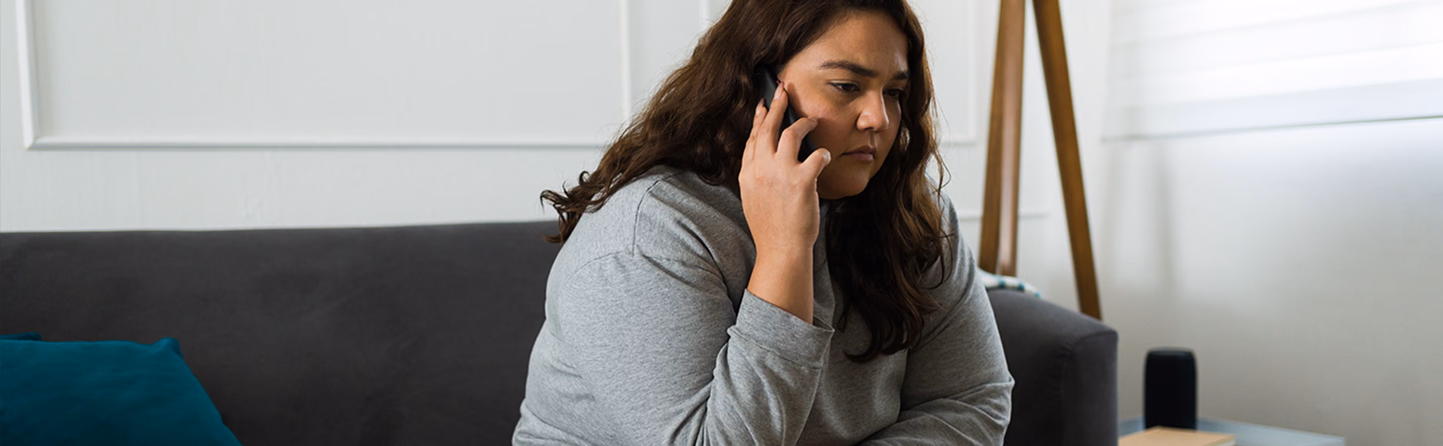woman sitting on the phone after layoff