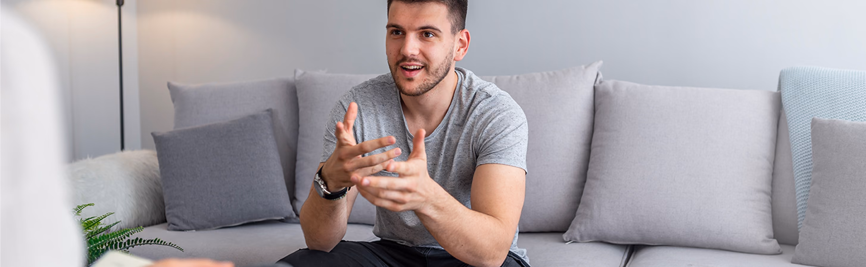Man having a conversation with his therapist in-person