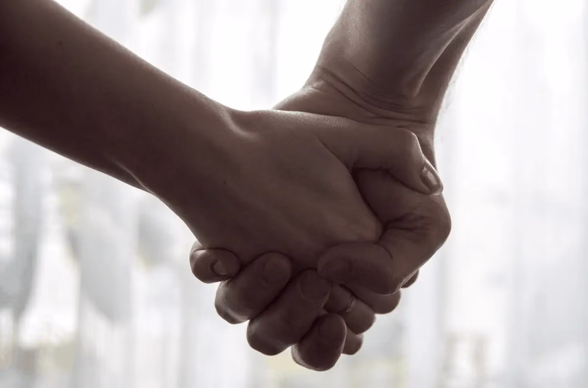 A couple holding hands