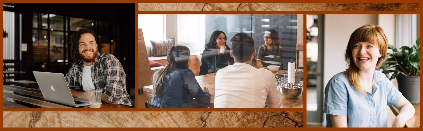 Four employees sit around a meeting table discussing work