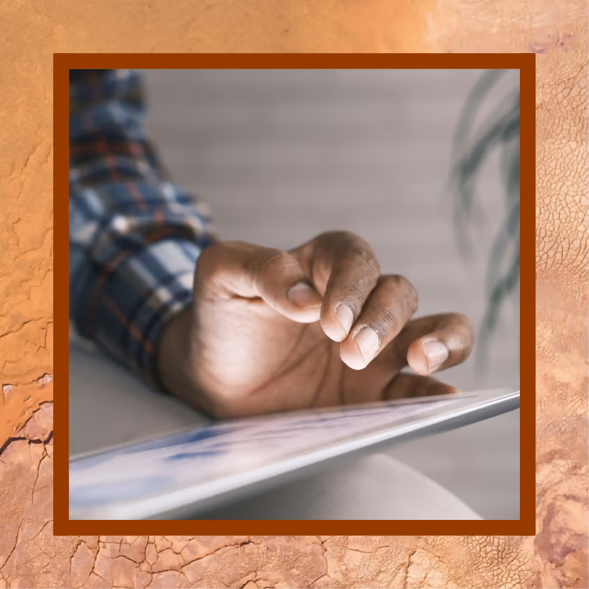 A man using an iPad for work
