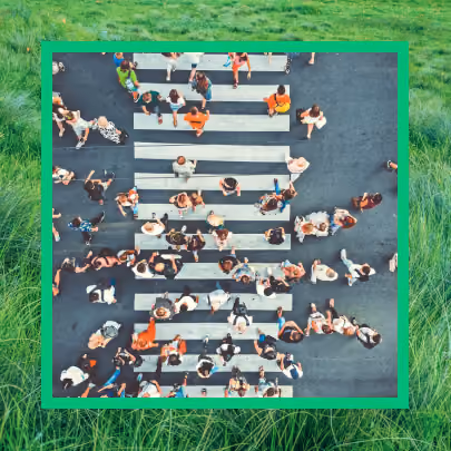 People walking over a city crosswalk