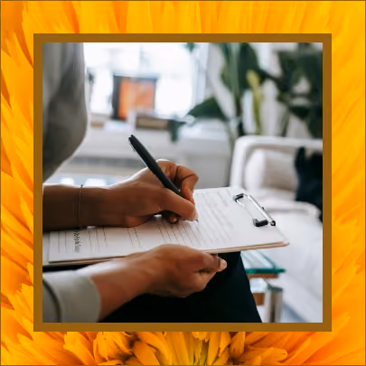 A therapist writing down notes in a session