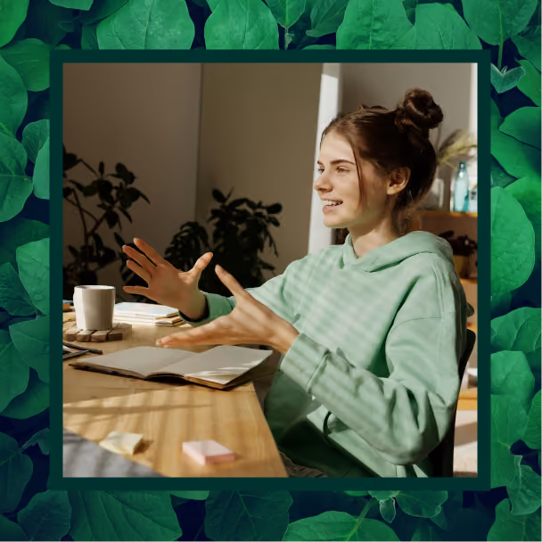 A young teenager girl talks to someone across a table