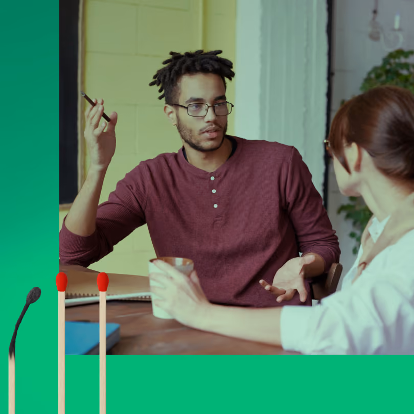 Man discussing business with a woman in the office