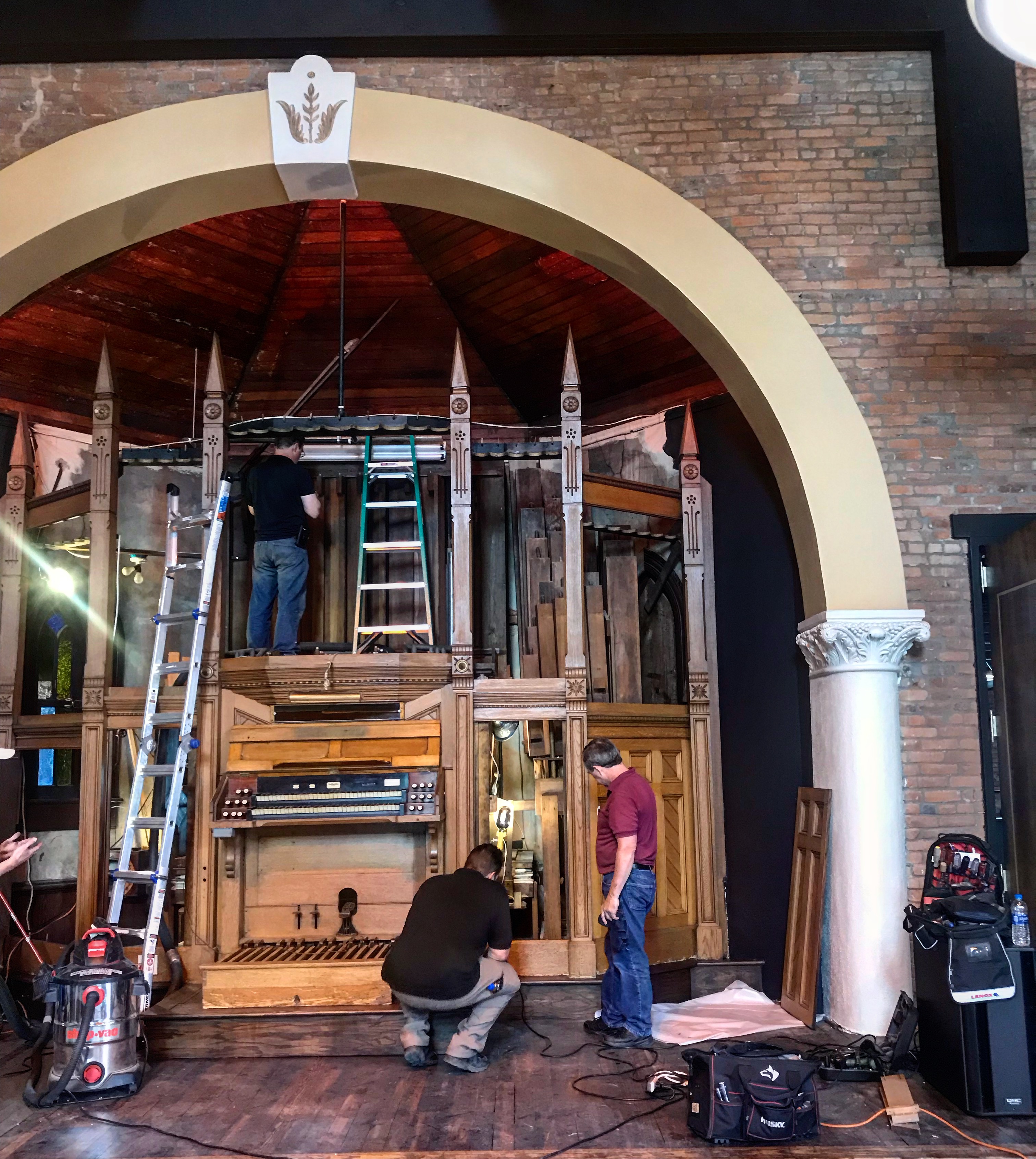 Milnar and Sons at work restoring Clementine's organ