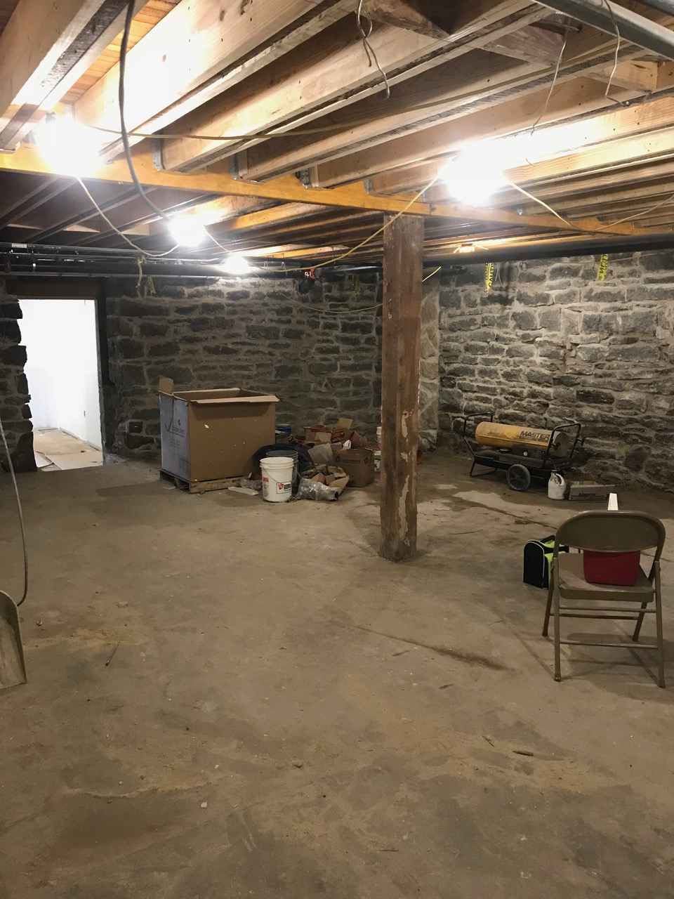 Stone wall repair underway