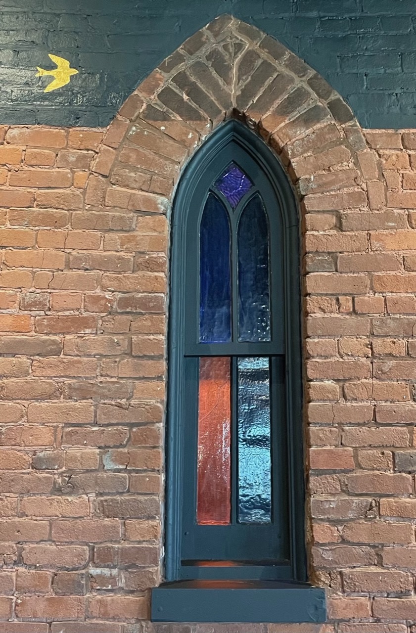 Little Bird and stained glass window