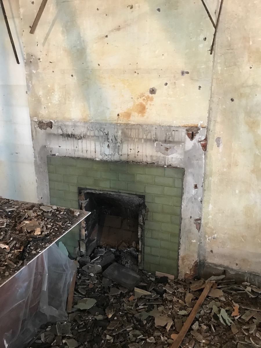 The original green tiles are revealed