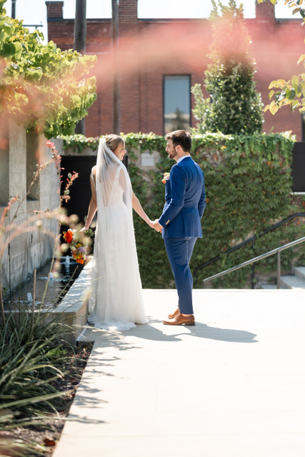 Couple standing by fountain