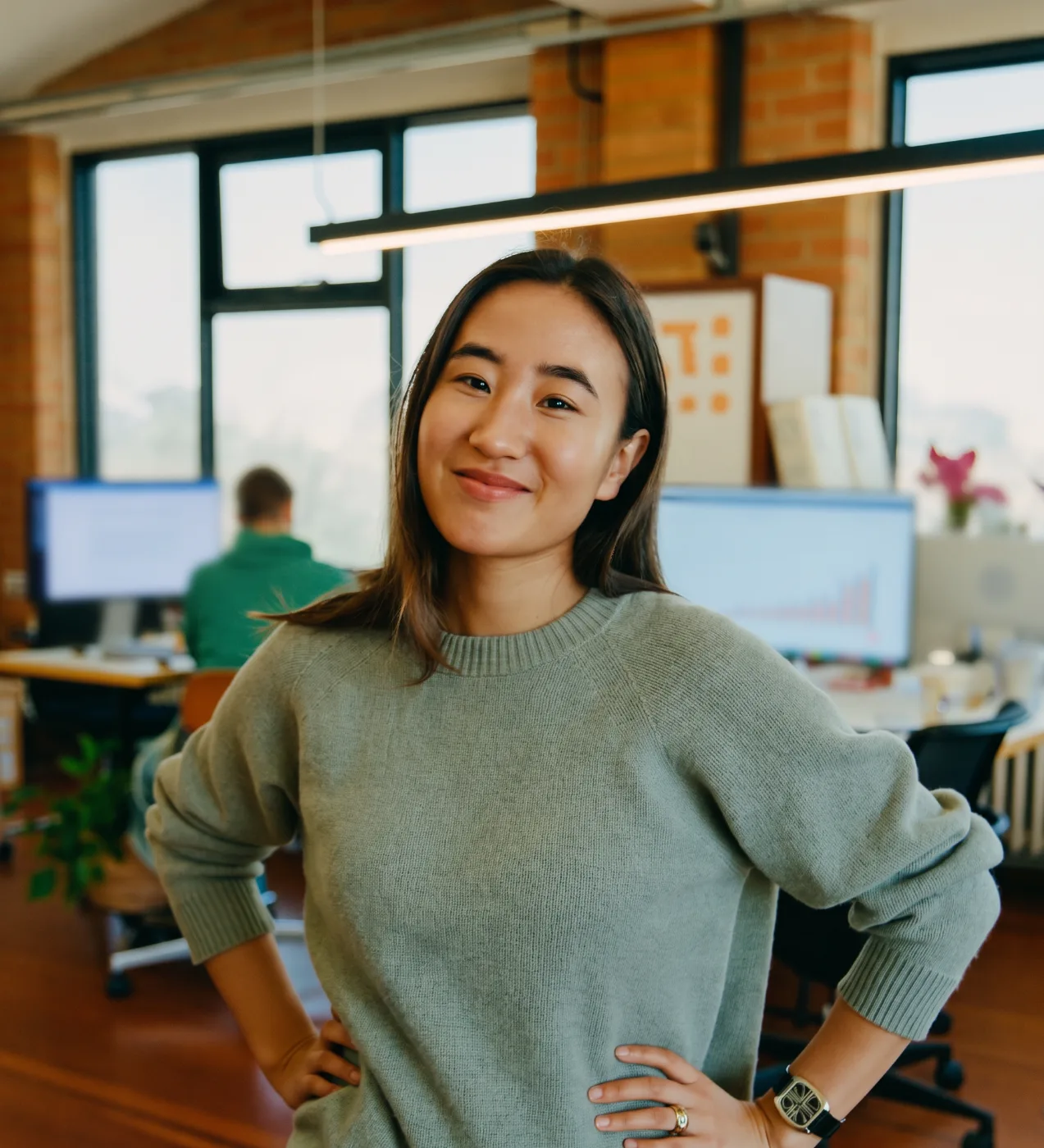 A SaaS head of finance standing in a bright loft office