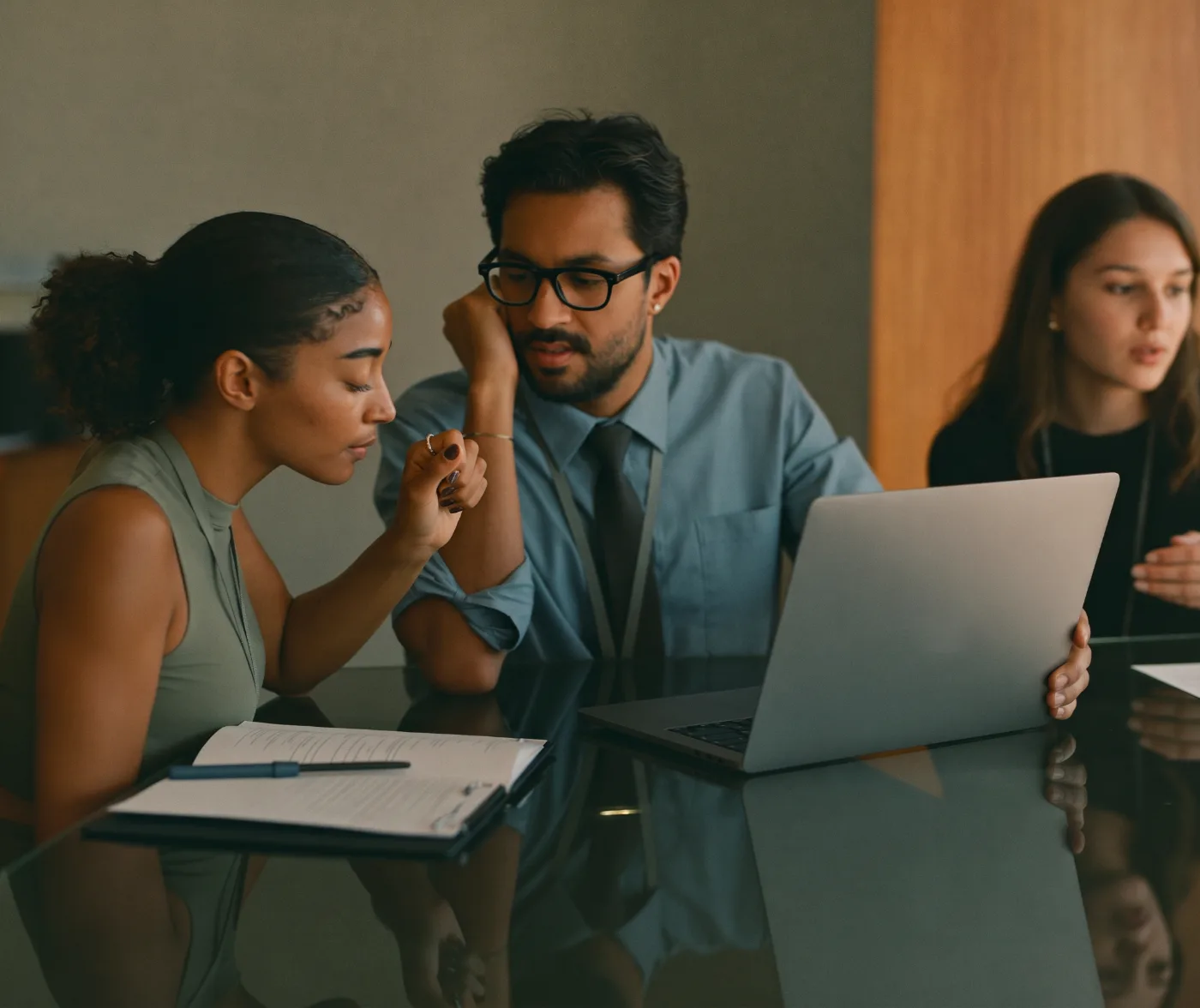 Two SaaS cofounders reviewing SaaS metrics with a finance advisor
