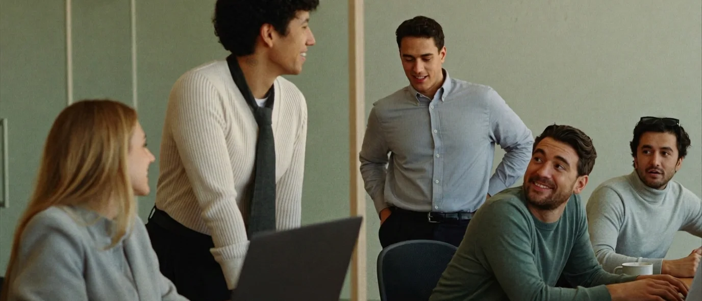 An in-house finance team working together in a modern office
