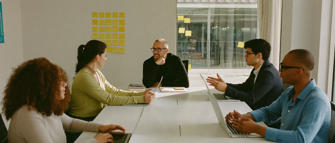 A professional services team collaborating around a table