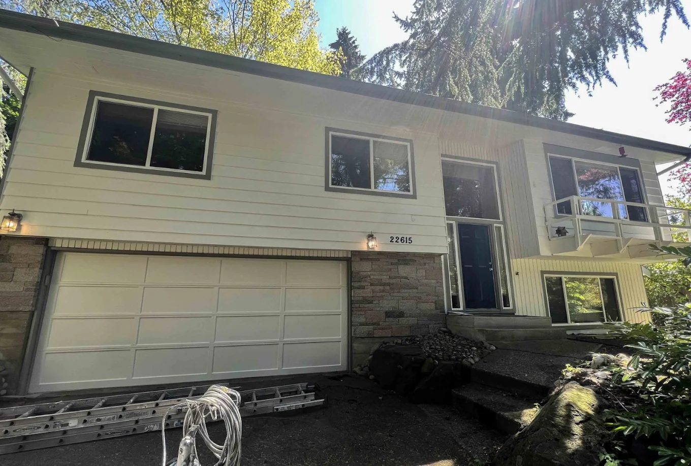 A newly repainted siding of a two-story home in a remote area in Bellevue 