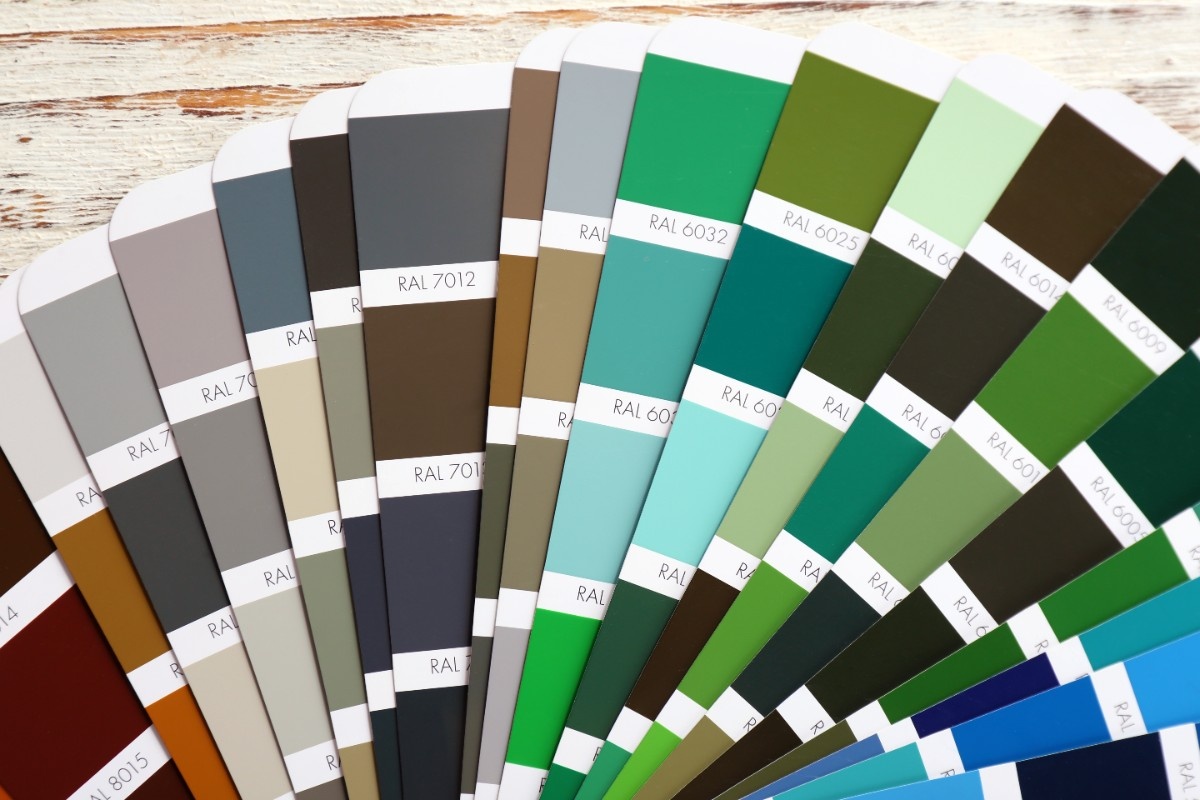 Paint color fan deck showing vinyl-safe shades for a Bellevue vinyl siding project