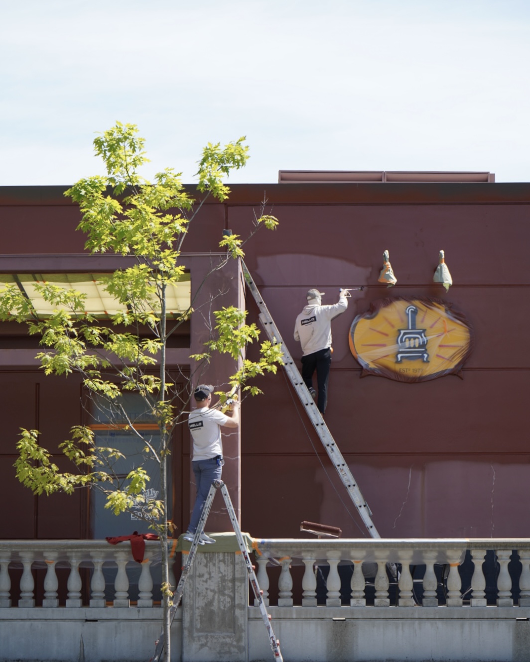 HELLO Painting crew working on a commercial exterior painting