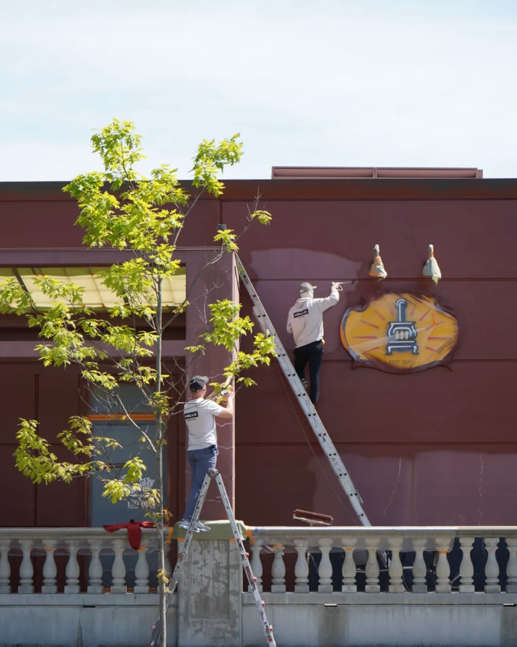 HELLO Painting crew working on a commercial exterior painting