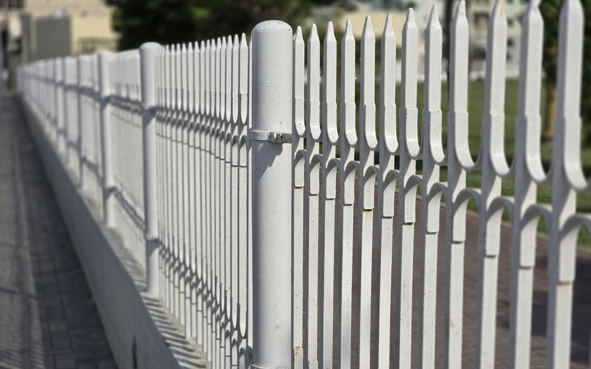 Minimalist White Iron Fence with Shadows