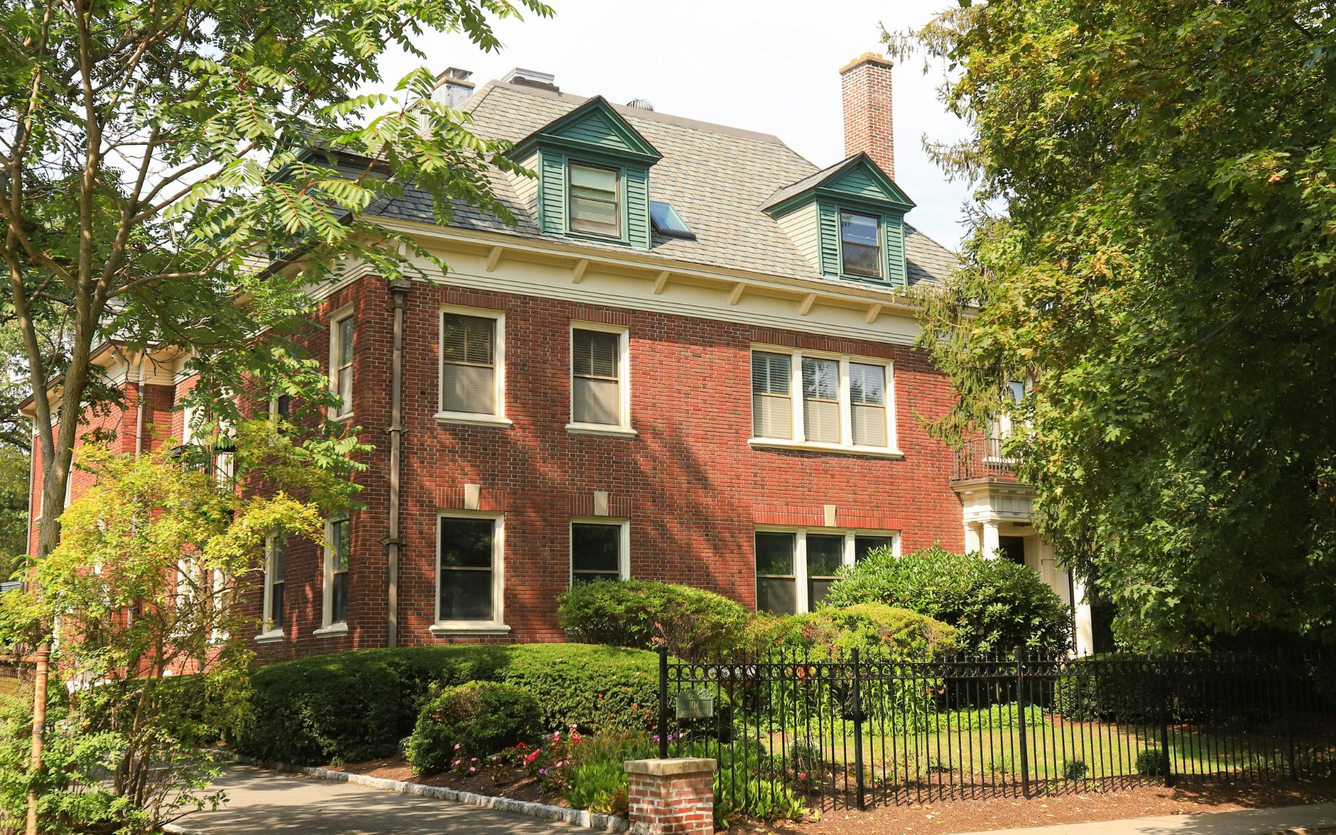 Charming Brick House with Lush Greenery