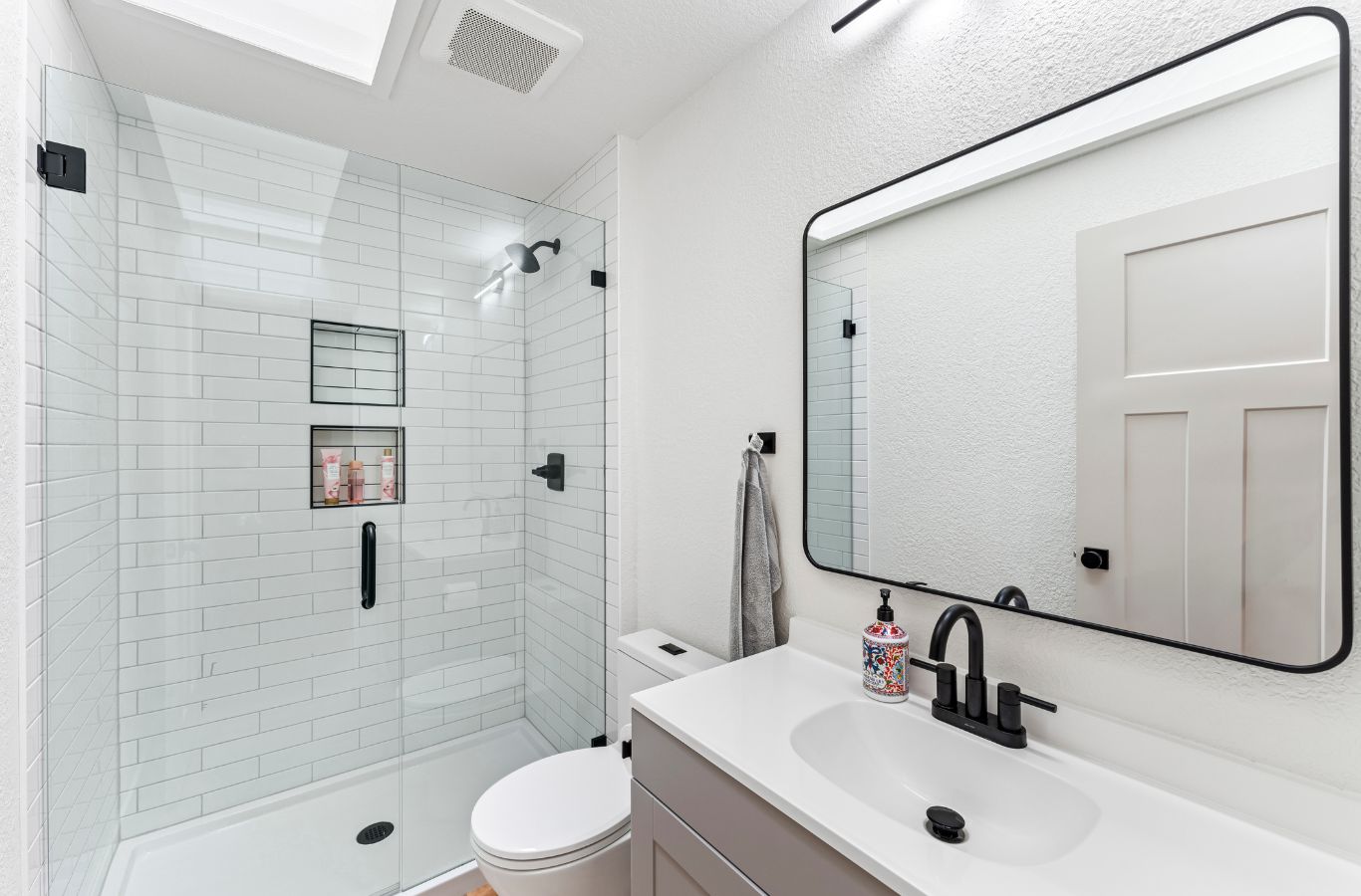 A NEW DAY Construction employee performing expert bathroom remodeling in Woodinville, WA with professional tools and craftsmanship.