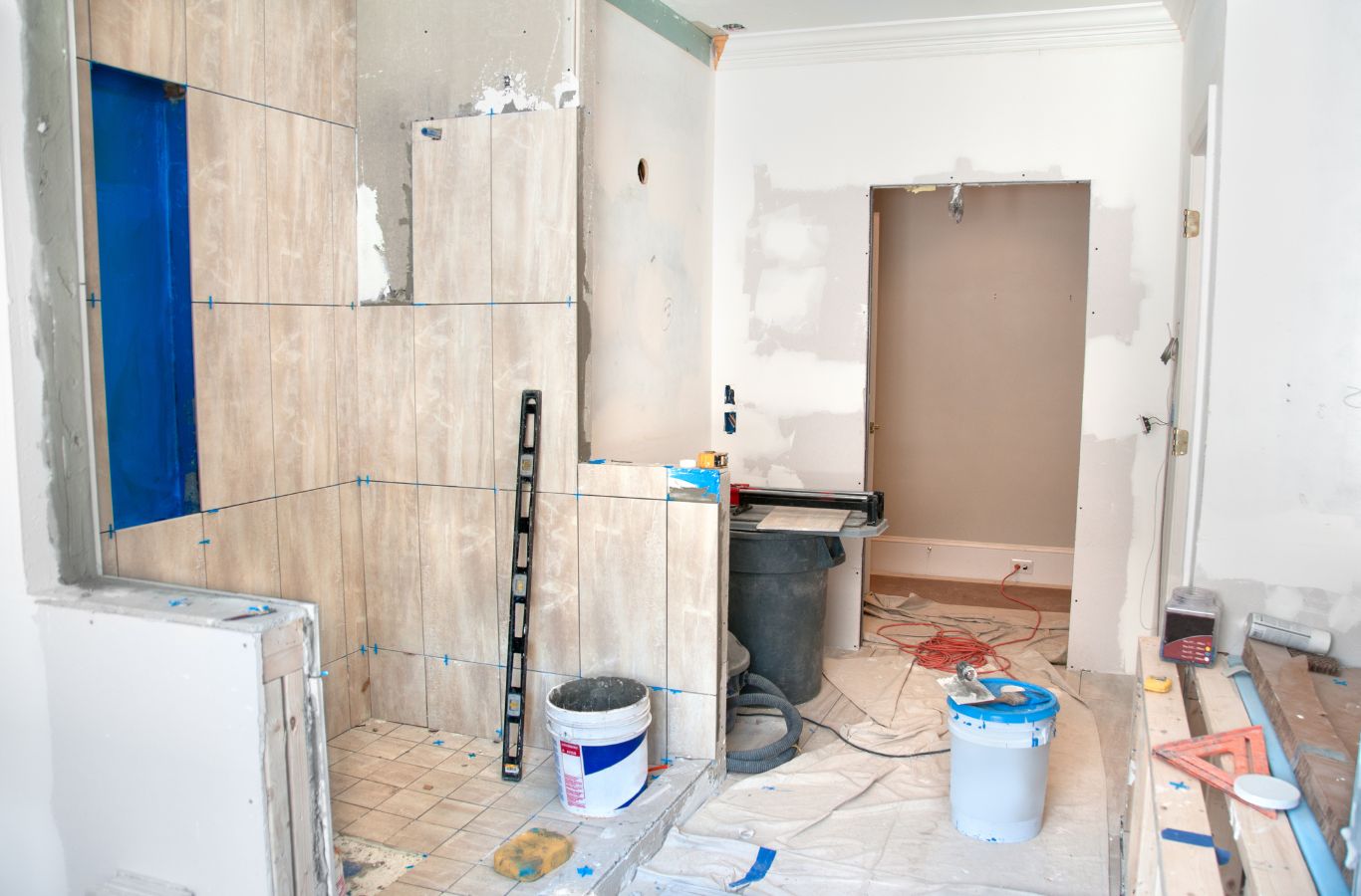 A NEW DAY Construction specialist remodeling a bathroom in Bellevue, WA, illustrating why our services exceed expectations. Bathroom Remodeling near me.