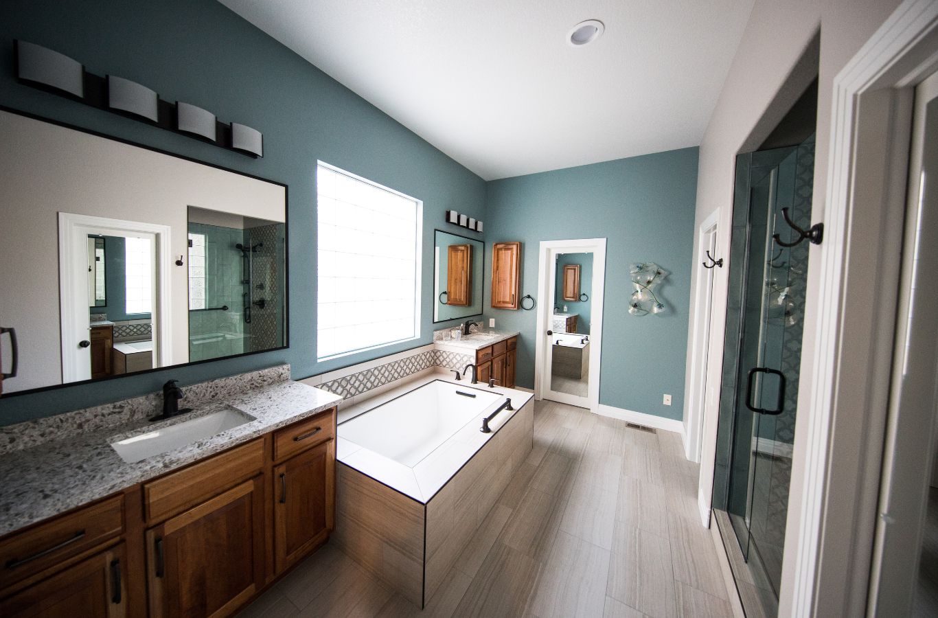 A NEW DAY Construction team member remodeling a bathroom in Lake Stevens, WA showing the practical benefits of local expert craftsmanship.