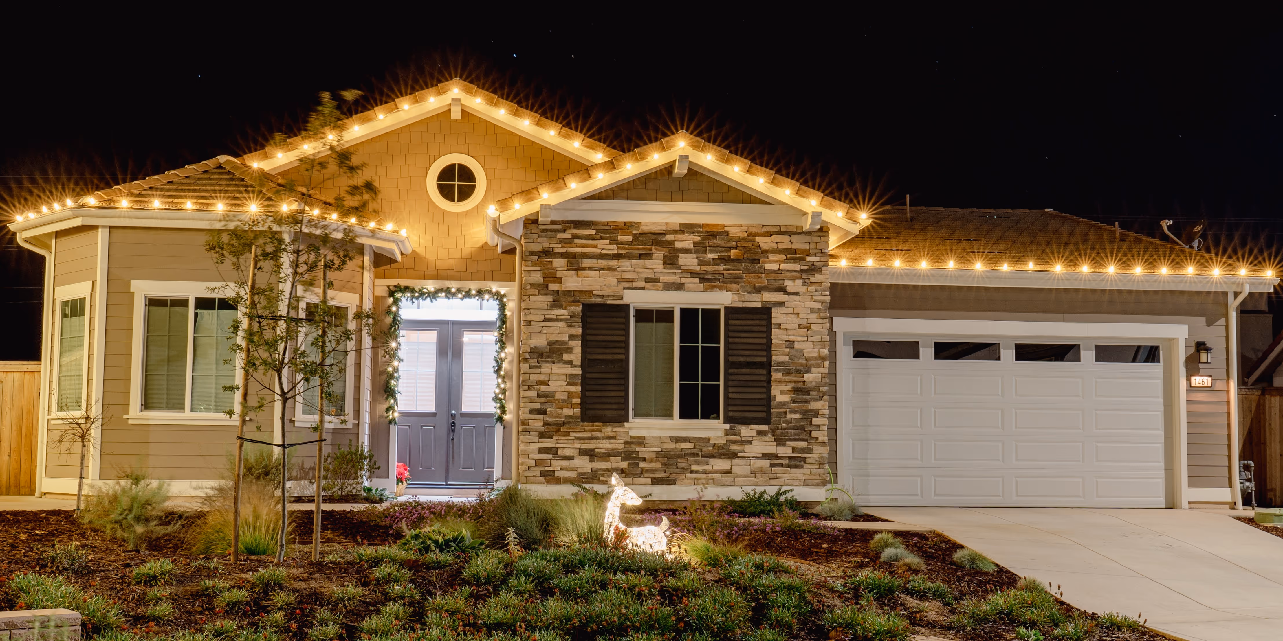A real Glow roofline lighting install in Orcutt, warm white lights along the roof edge at dusk