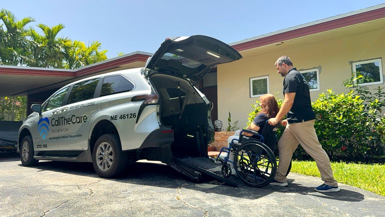CallTheCare caregiver assisting a wheelchair user into a Toyota Sienna using a rear-entry ramp