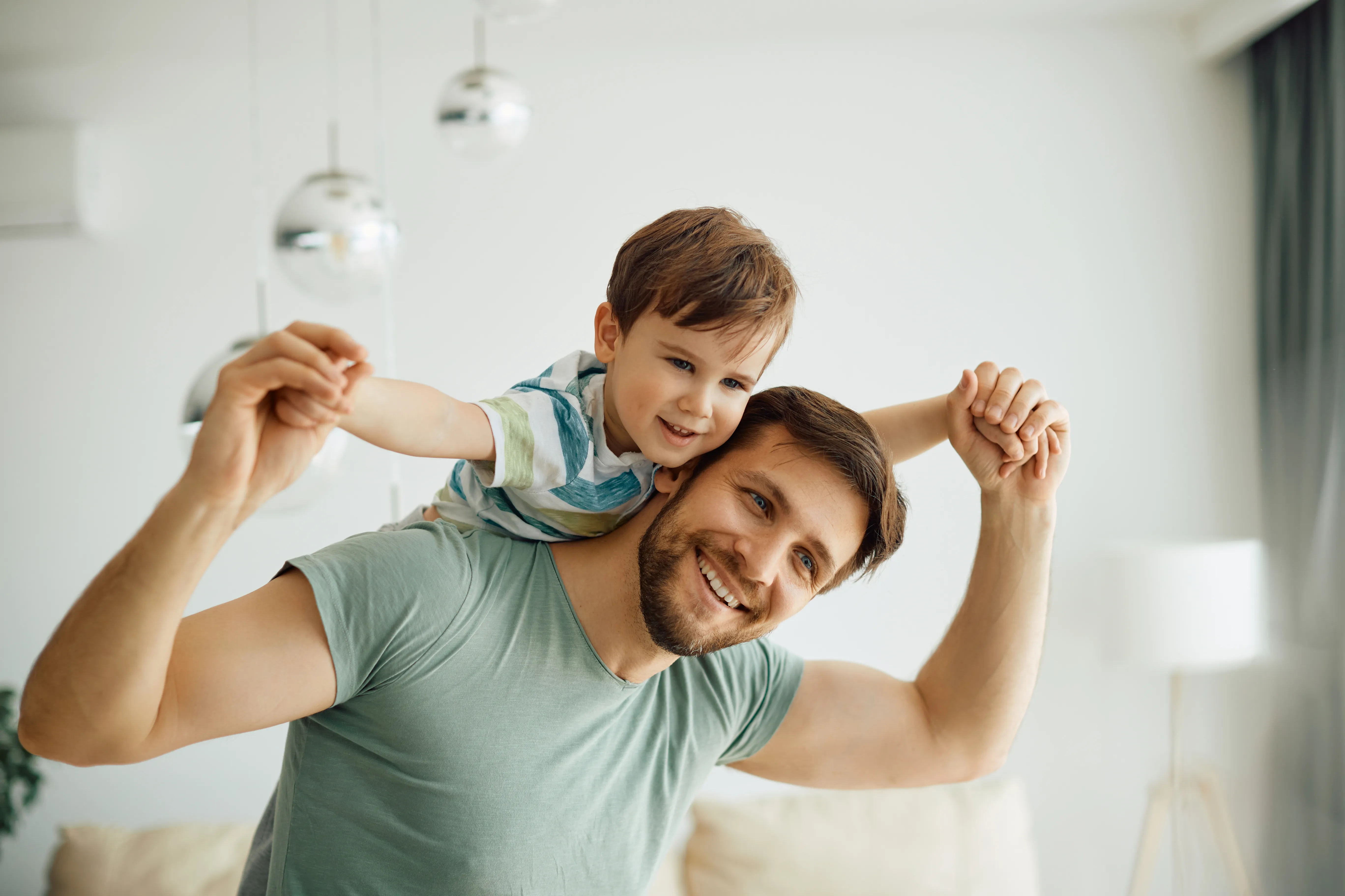 A father with a son on his back.