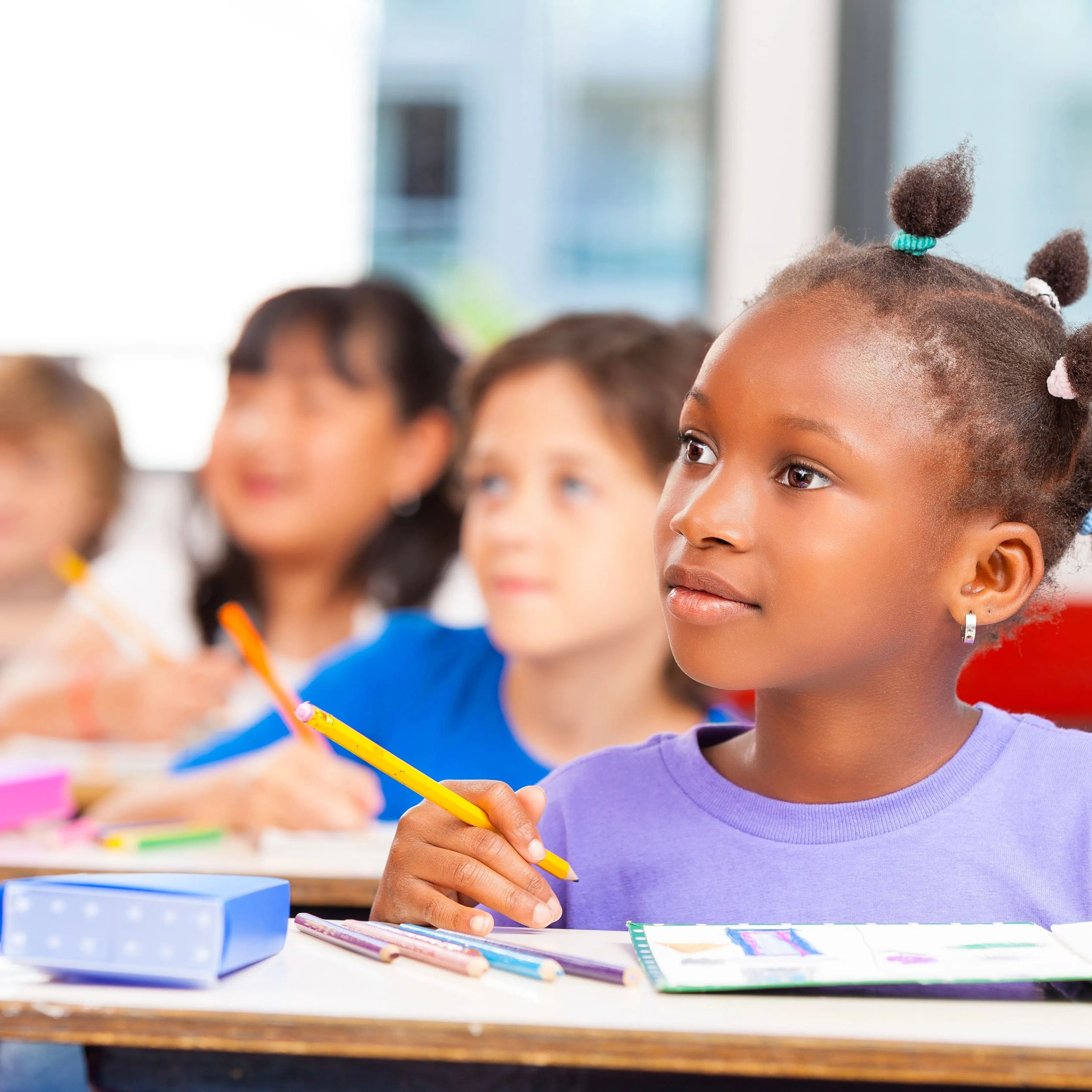 A young girl sitting in class.