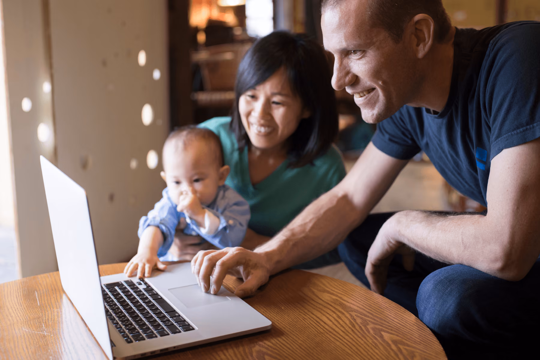 A family looking at the computer together.