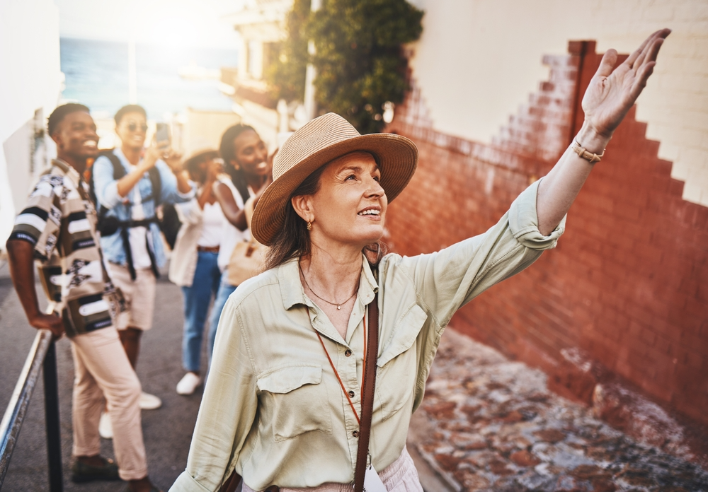 A tour guide displaying her role as the group leader and educator.