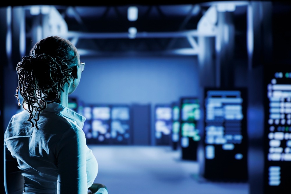 A woman looking at digital signs.
