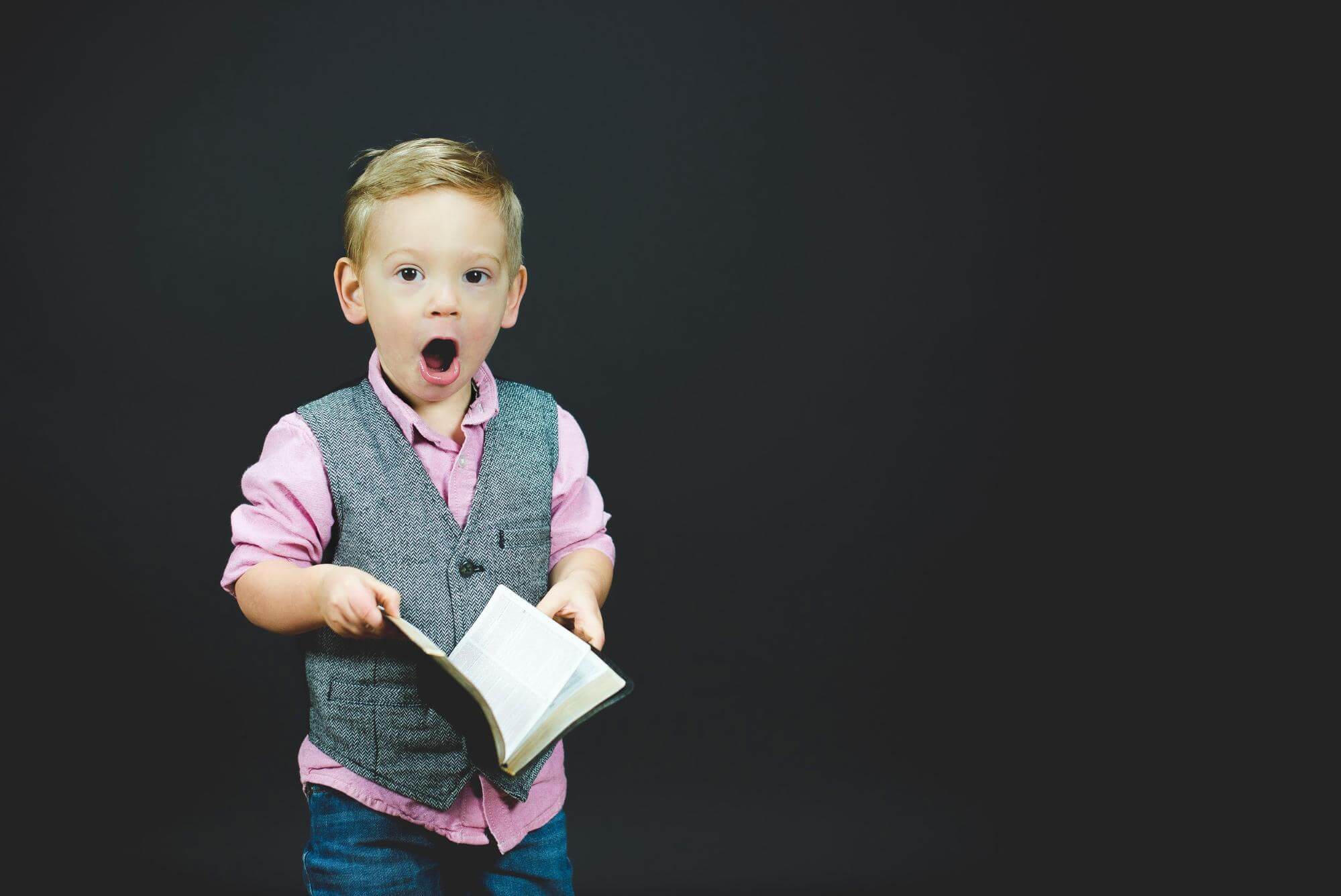 little boy with a book