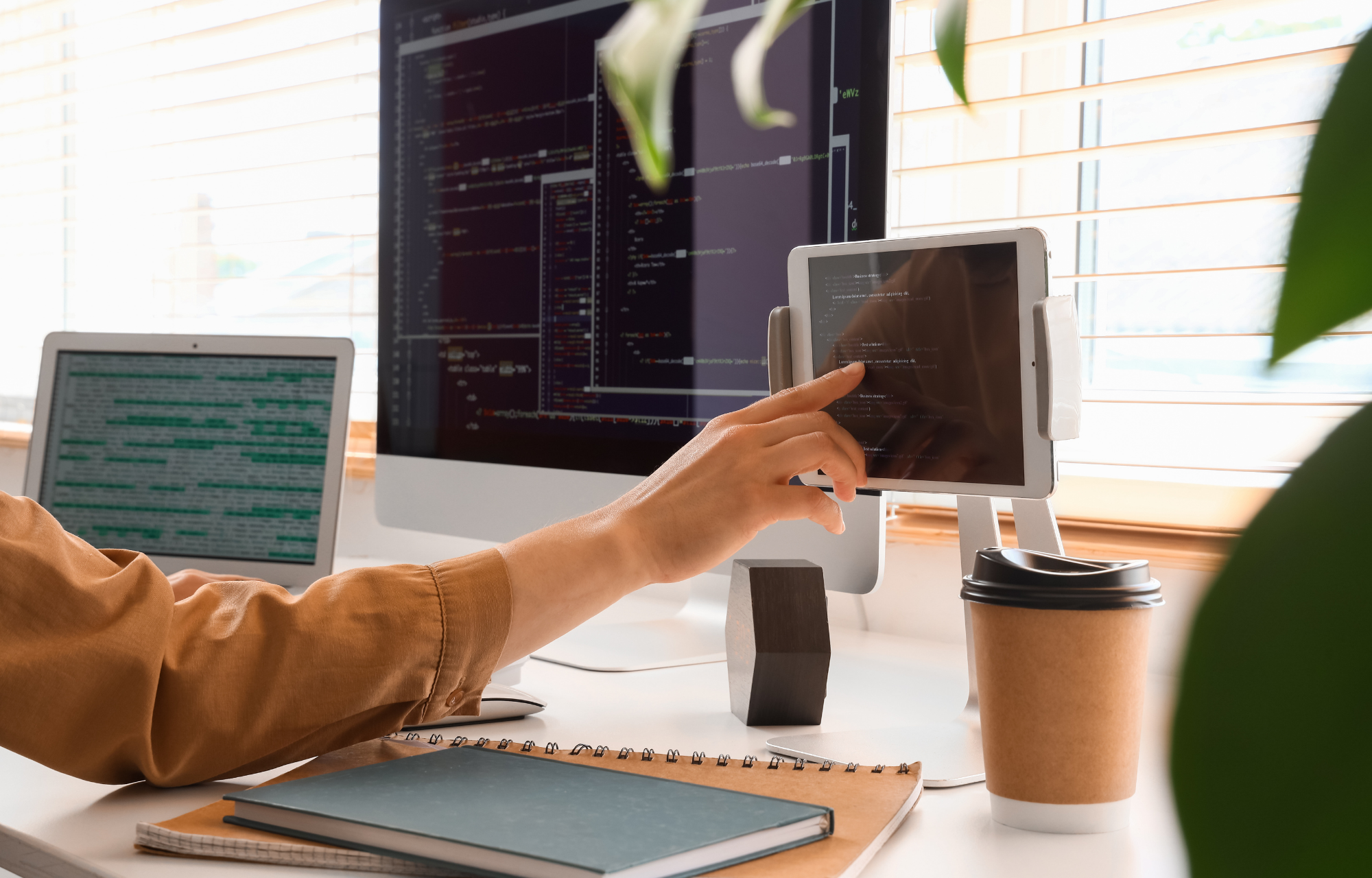 Developer analyzing code and AEO search strategies on a tablet
