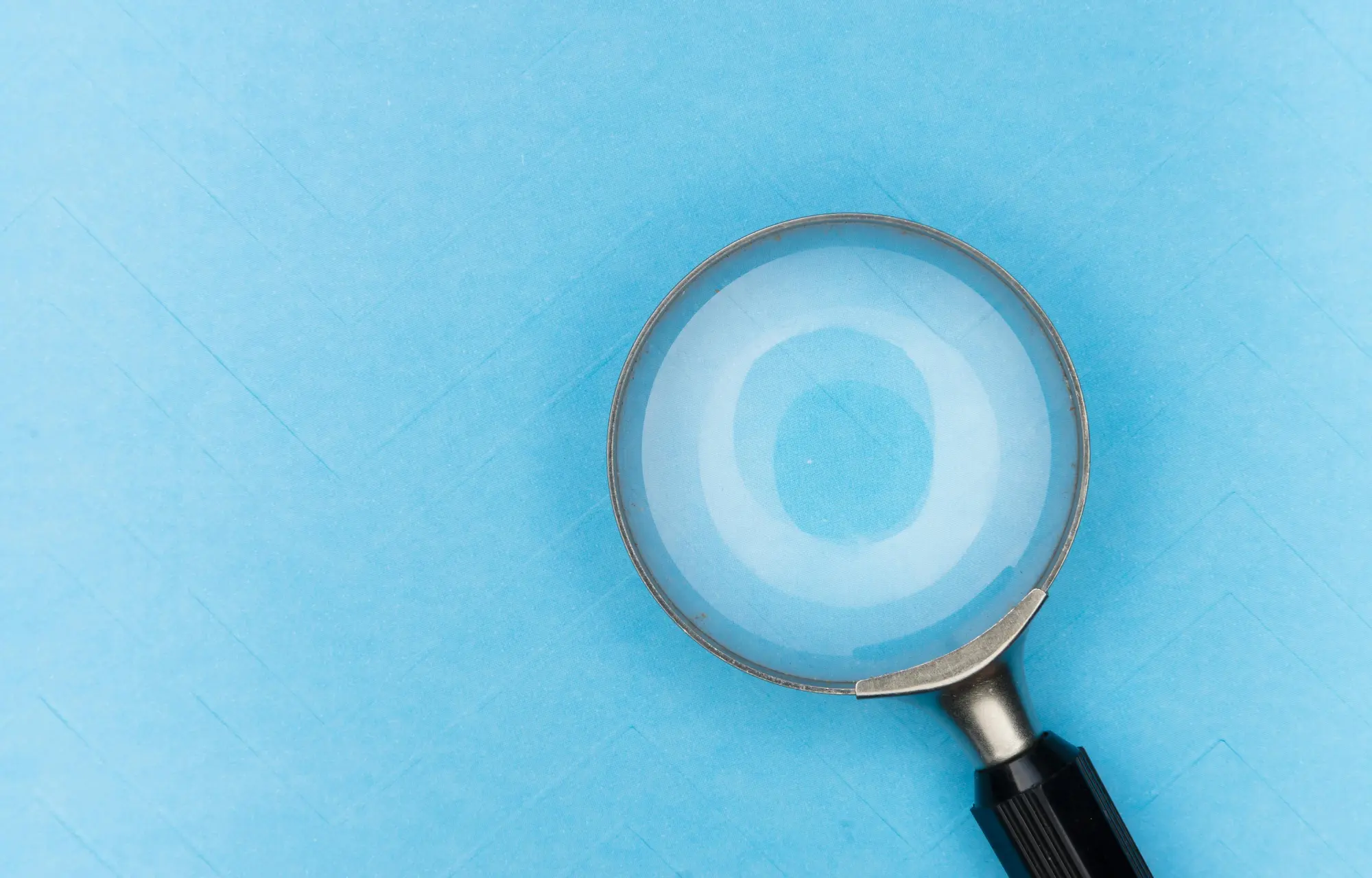 Magnifying glass focusing on full funnel marketing measurement