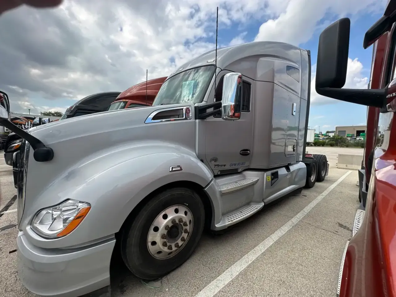 Kenworth T680 heavy-duty truck parked in a service lot, ready for suspension inspection and repair.
