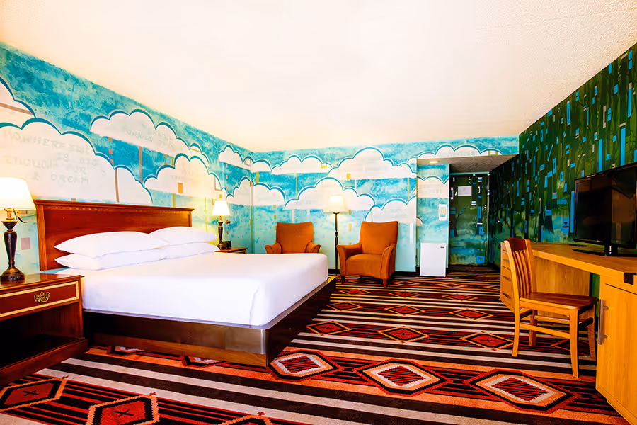 Colorful Artist guestroom with mural on the wall